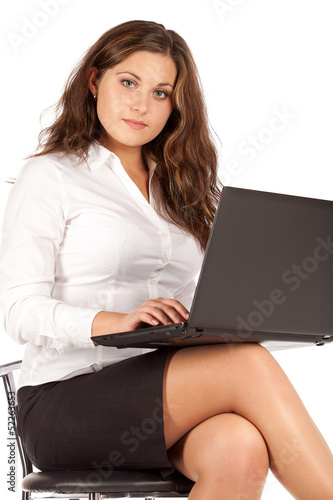 Portrait of successful businesswoman working with laptop