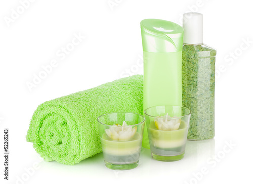 Bathroom bottles, towel and candles