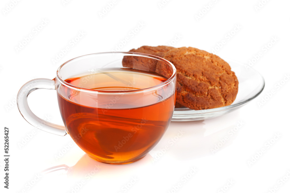 Glass cup of black tea with homemade cookies Glass cup of black tea with homemade cookies