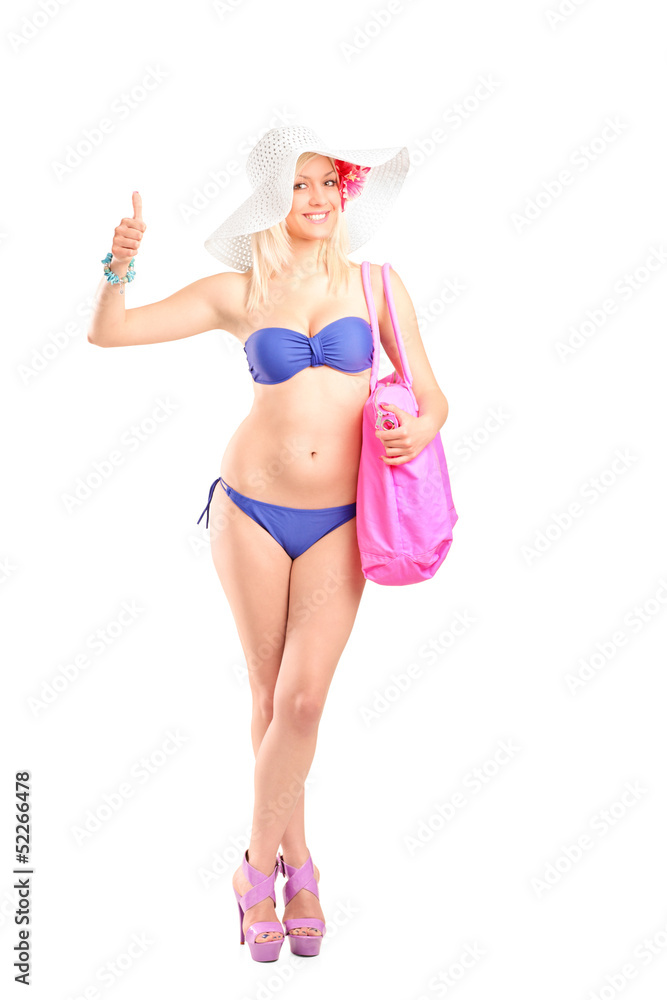 Full length portrait of an attractive blond woman in bikini givi Full length portrait of an attractive blond woman in bikini givi