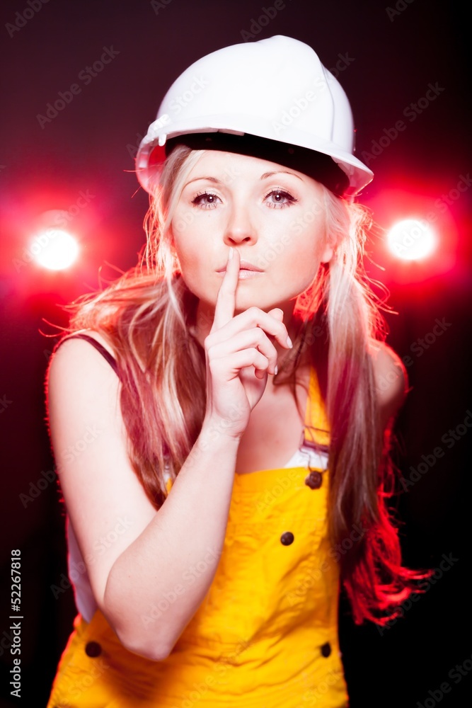 Naklejka premium Young architect woman construction worker, glowing lights
