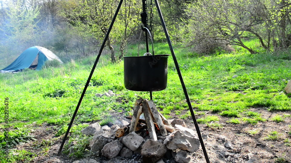 Pot boiling on fire. Fireplace in the forest. Pot boiling on fire. Fireplace in the forest.