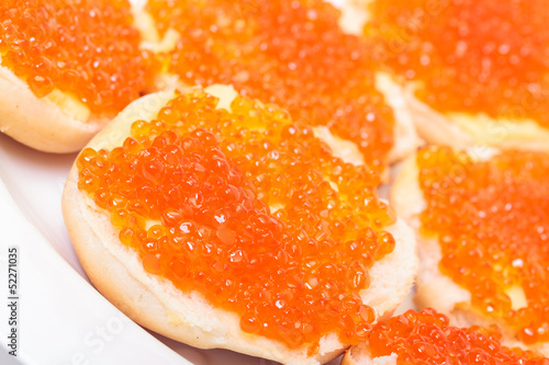 Sandwiches with red salted caviar