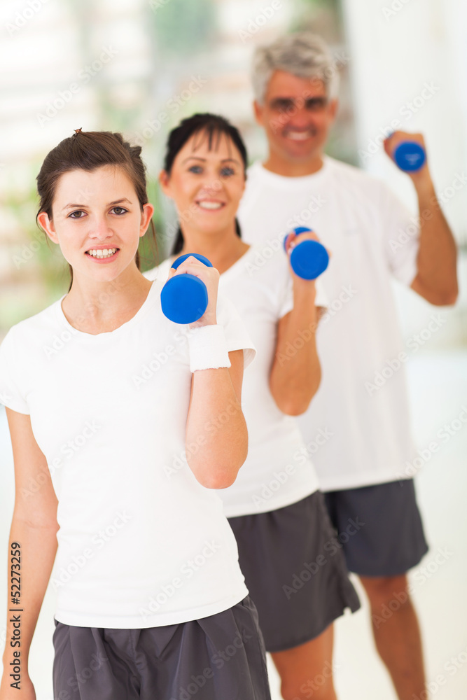 line up of family exercising with dumbbells line up of family exercising with dumbbells
