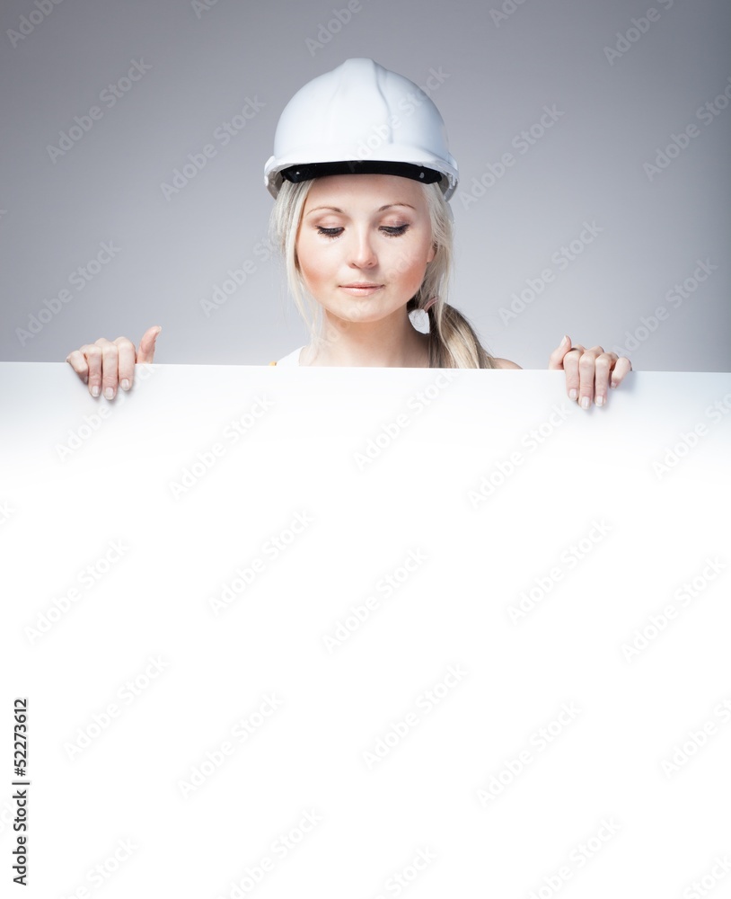 Young builder craftswoman construction worker, empty banner Young builder craftswoman construction worker, empty banner