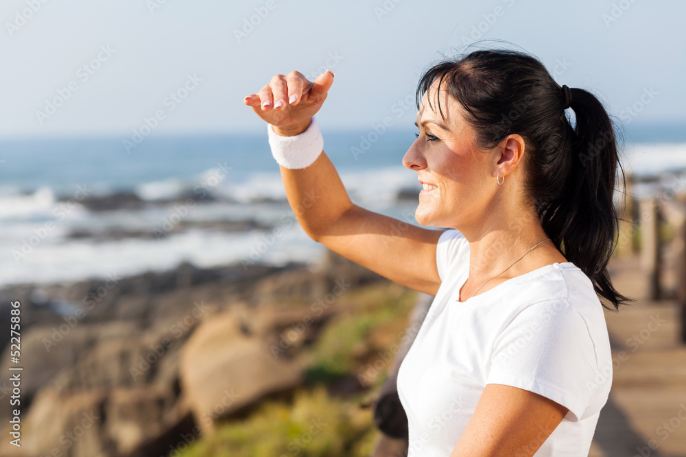 fit mature woman looking into distance fit mature woman looking into distance