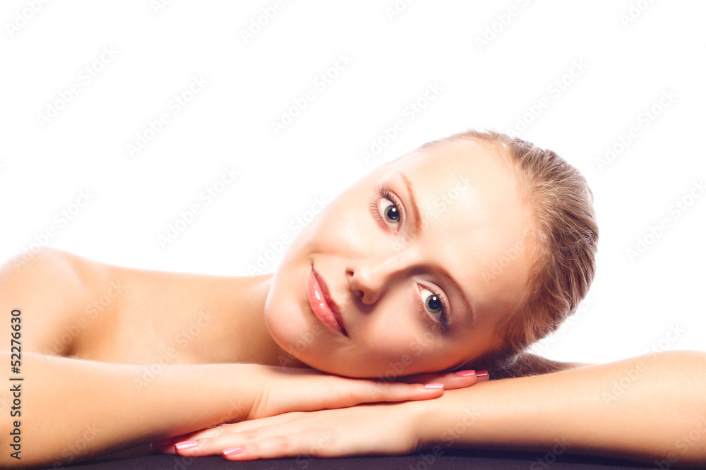 Attractive young woman lying on her hands. Isolated over white b Attractive young woman lying on her hands. Isolated over white b