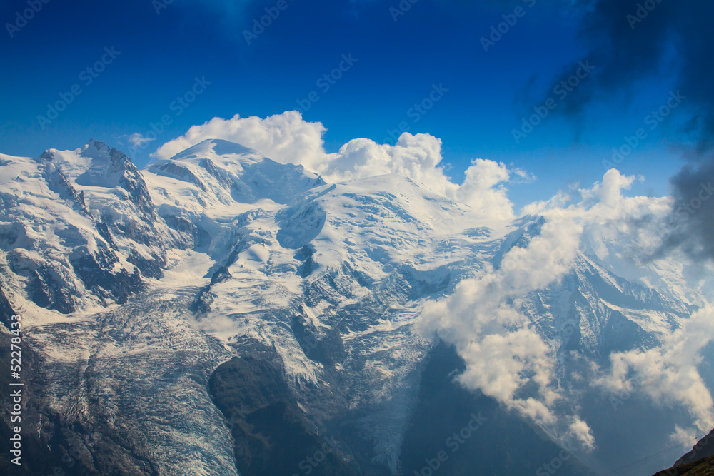 Rocky peaks and storm clouds over French Alps, in summer Rocky peaks and storm clouds over French Alps, in summer