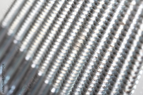 Close-up of various steel nuts and bolts