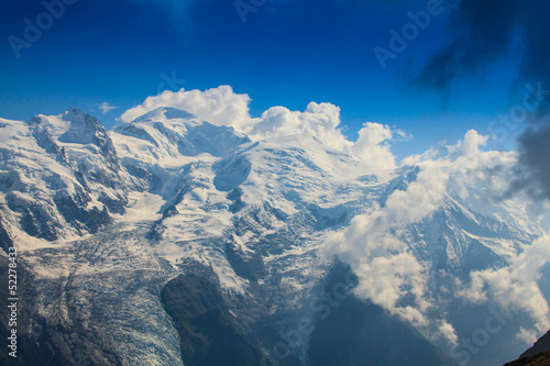Rocky peaks and storm clouds over French Alps, in summer © Calin Tatu