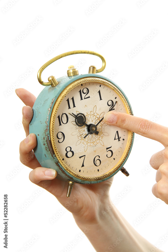 old alarm clock in hands, isolated on white old alarm clock in hands, isolated on white