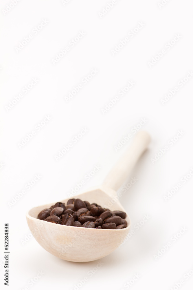wooden spoon with coffee beans, isolated on white wooden spoon with coffee beans, isolated on white