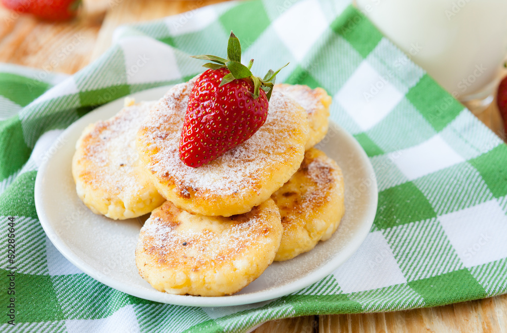 cheese pancakes with powdered sugar and strawberries cheese pancakes with powdered sugar and strawberries