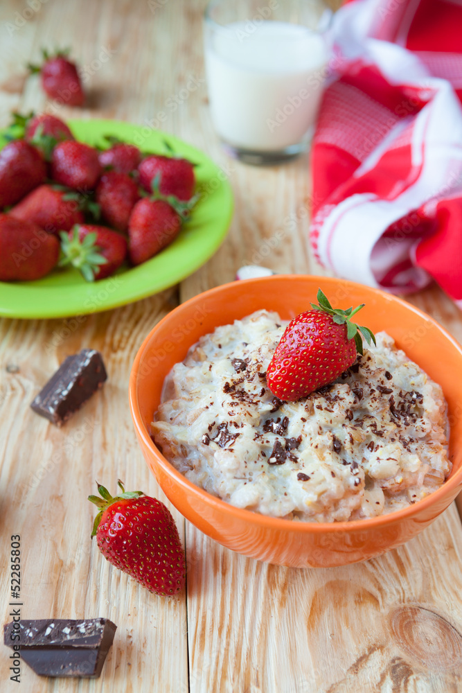 oatmeal in a bowl with milk and strawberries, oatmeal in a bowl with milk and strawberries,