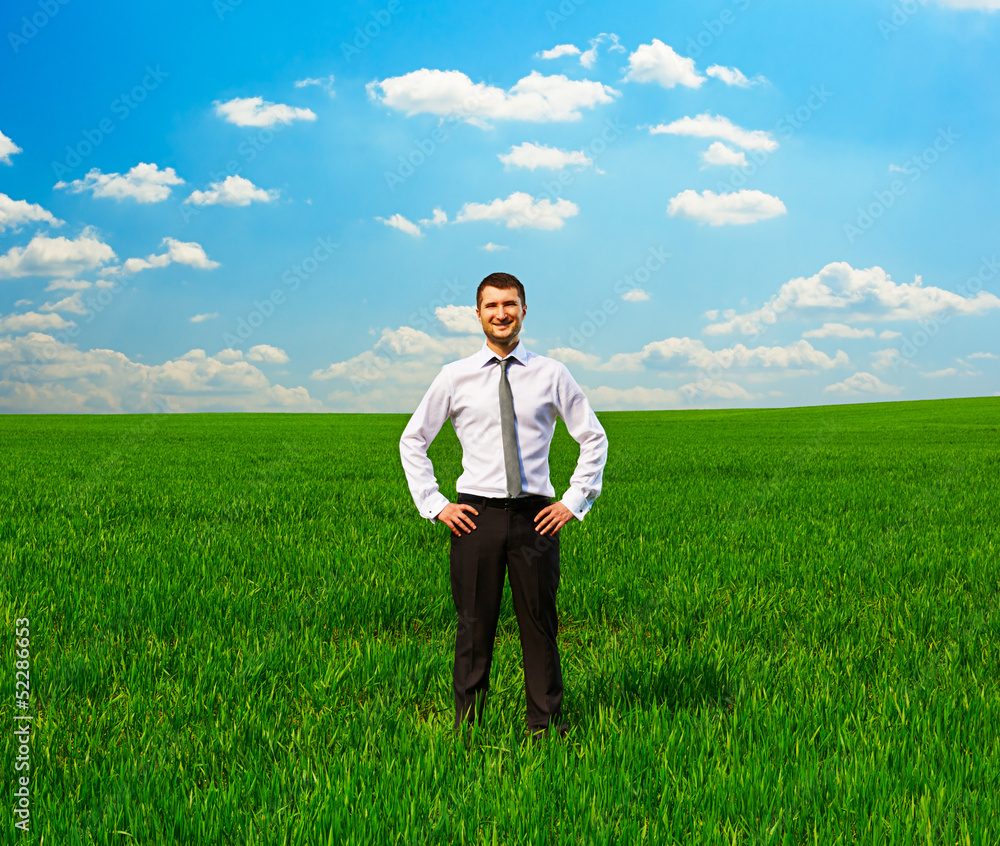 man standing on green grass and smiling man standing on green grass and smiling