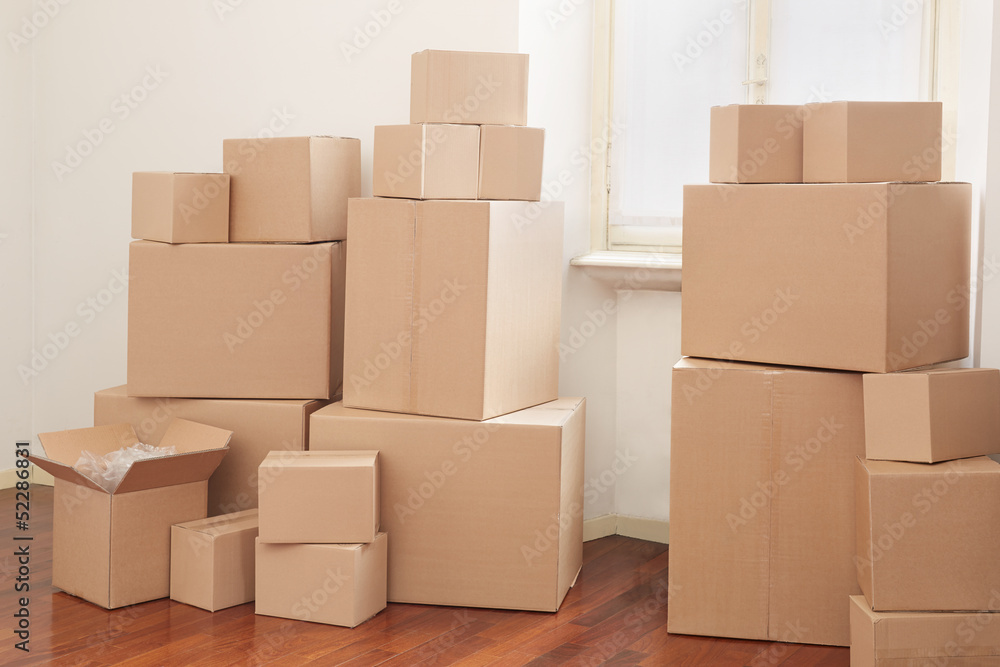 Cardboard boxes in apartment, moving day Cardboard boxes in apartment, moving day