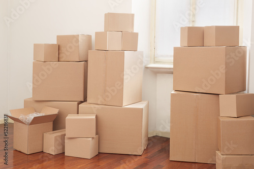 Cardboard boxes in apartment, moving day © andersphoto