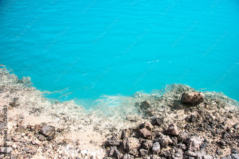 Amazing Blue lake among the sand and rocks
