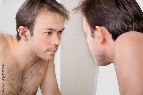 Man checks his reflection