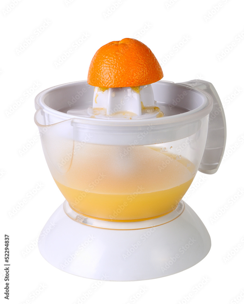 Juicer with juice and an orange half Juicer with juice and an orange half