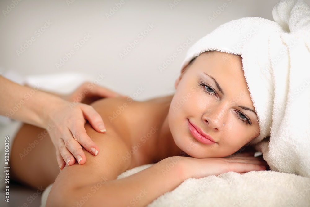 Closeup of an attractive young woman receiving massage Closeup of an attractive young woman receiving massage