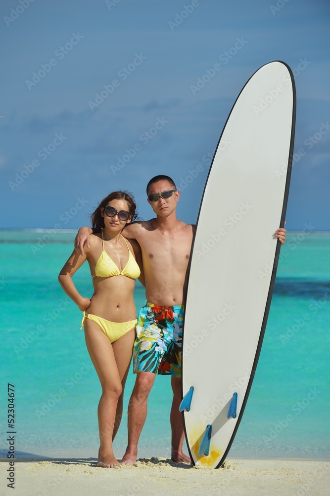 happy young  couple enjoying summer on beach