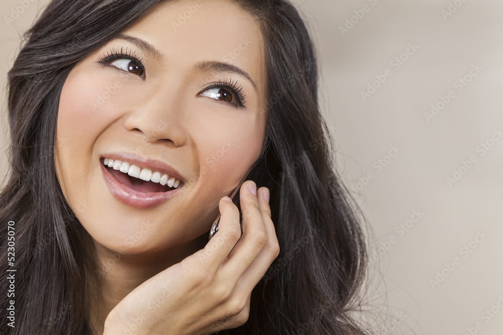 Fototapeta premium Beautiful Asian Chinese Woman Talking on Cell Phone