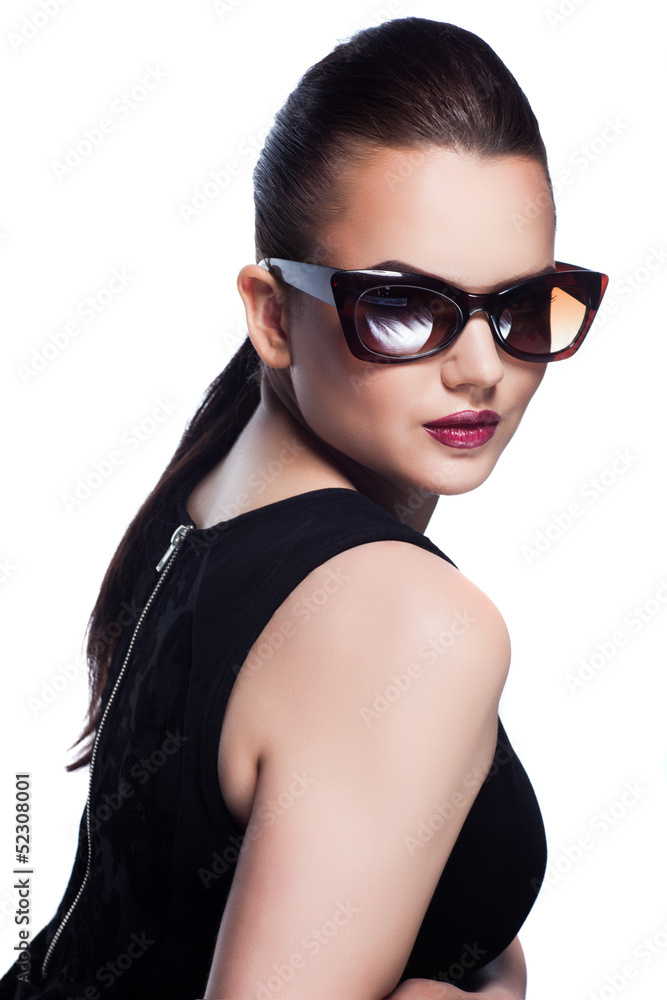 Fototapeta premium Portrait of beautiful and fashion girl in sunglasses, studio sho