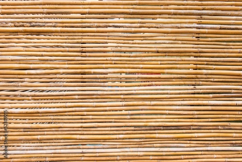Light brown thin bamboo stick background