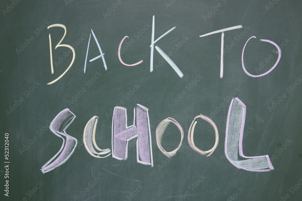 back to school title written with chalk on blackboard back to school title written with chalk on blackboard