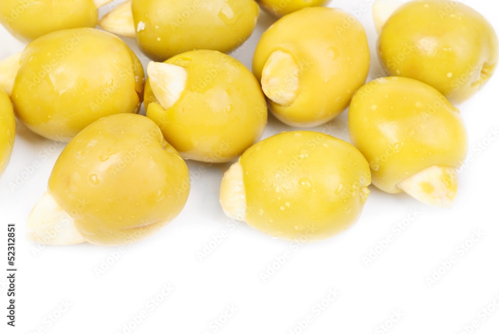 Green olives stuffed with almonds isolated on white background Green olives stuffed with almonds isolated on white background