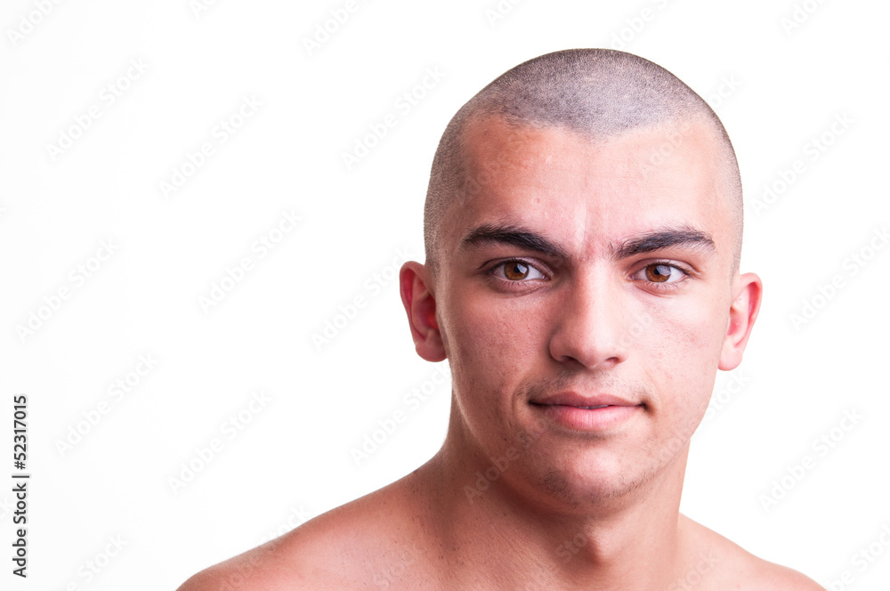 Obraz premium Close up studio shot of bald young man over white background