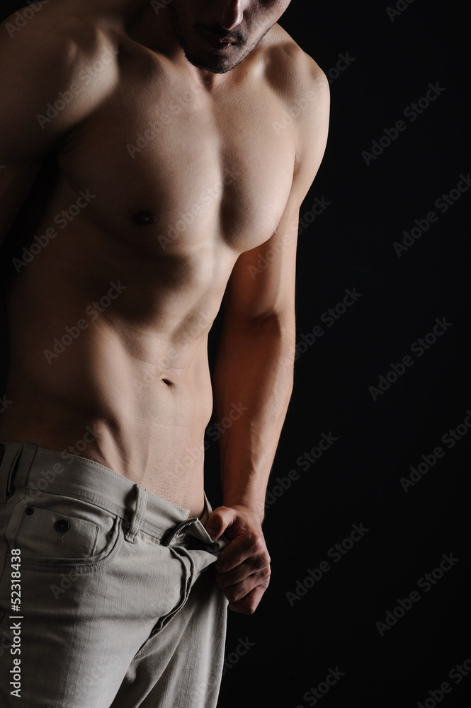 Sexy Muscular Man isolated black background