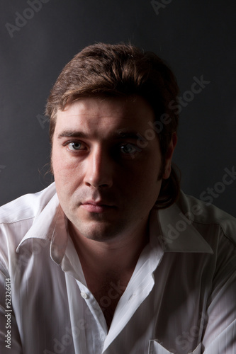 man posing in white shirt