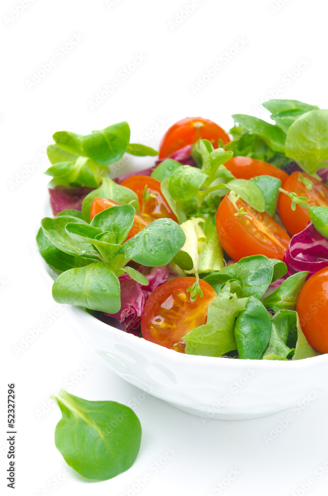 bowl of fresh salad and cherry tomatoes isolated, close-up bowl of fresh salad and cherry tomatoes isolated, close-up