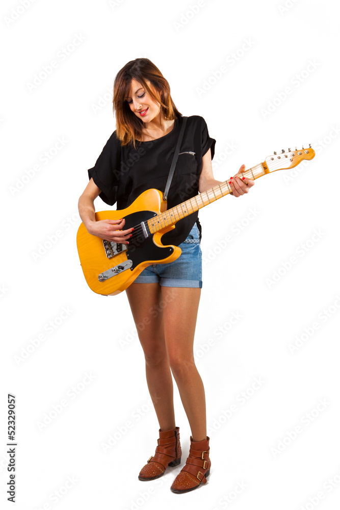 Beautiful woman playing electric guitar. Isolated in white. Stock-Foto |  Adobe Stock