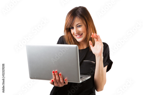 Young woman using a laptop in a video conference.