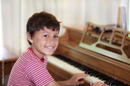 Young boy playing piano