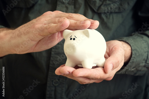 Piggy coin bank in hands