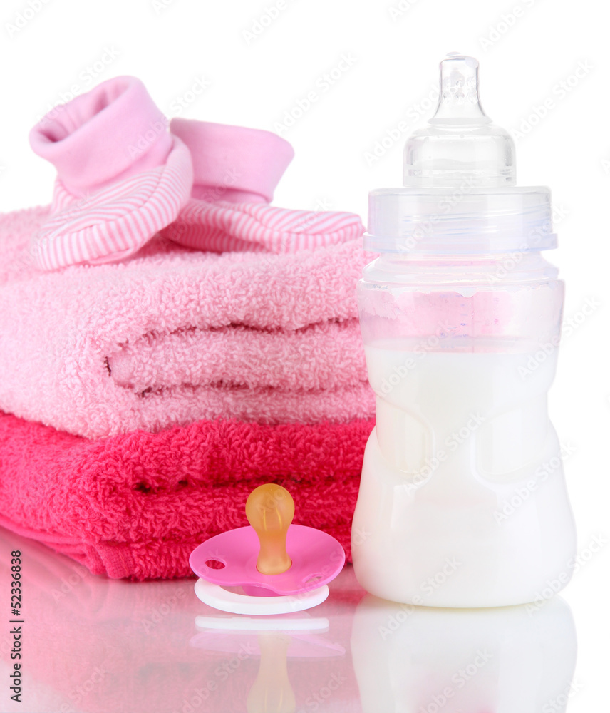 Bottle for milk with towels and nipple isolated on white