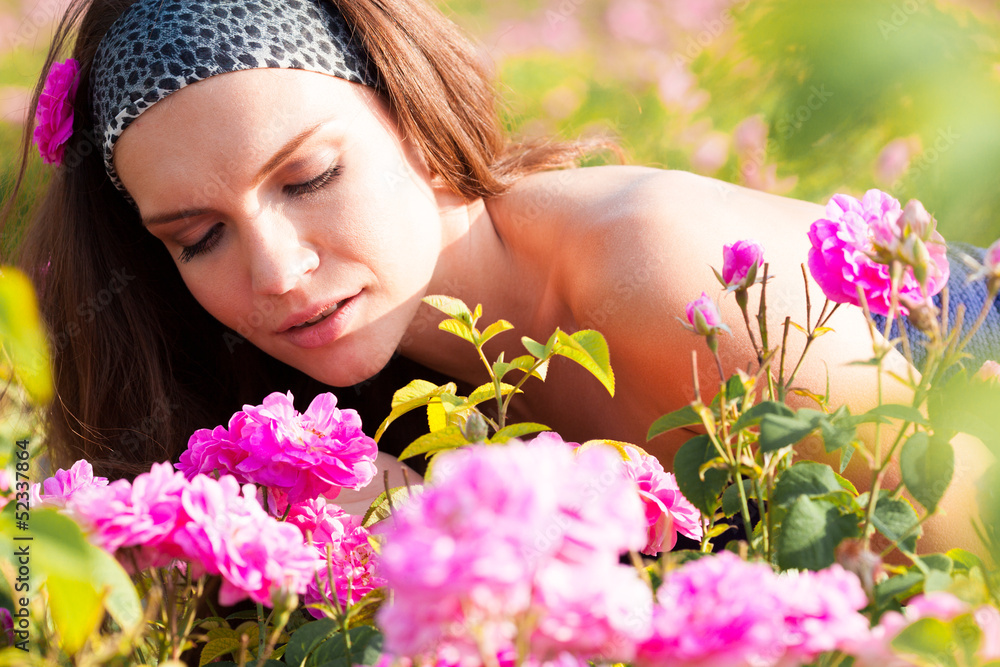 Woman in rose garden