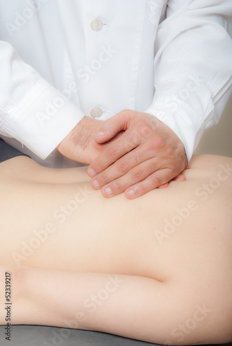 Woman athlete takes physiotherapy therapy massage technique