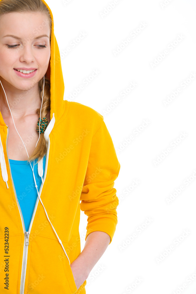 Happy teenager girl in earphones looking on copy space Happy teenager girl in earphones looking on copy space