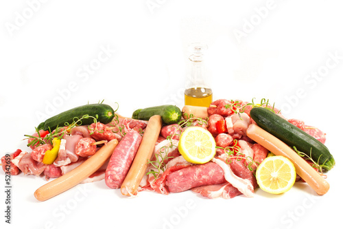 raw meat with rosemary, lemon on a white background