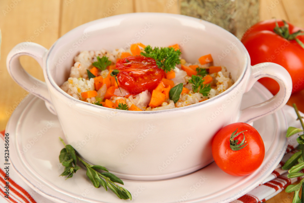 Delicious rice with vegetables and herbs in pot Delicious rice with vegetables and herbs in pot