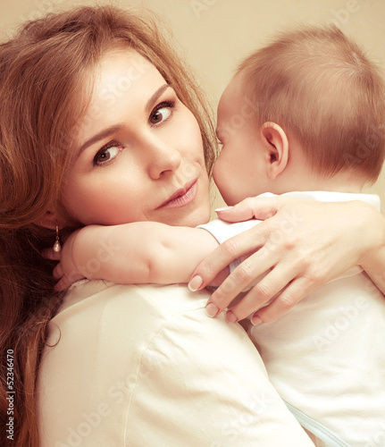Young happy mother with baby photo