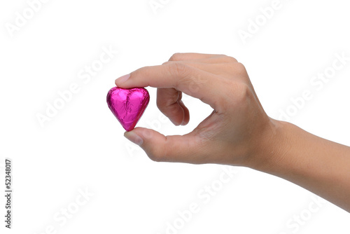 woman finger pick heart chocolate