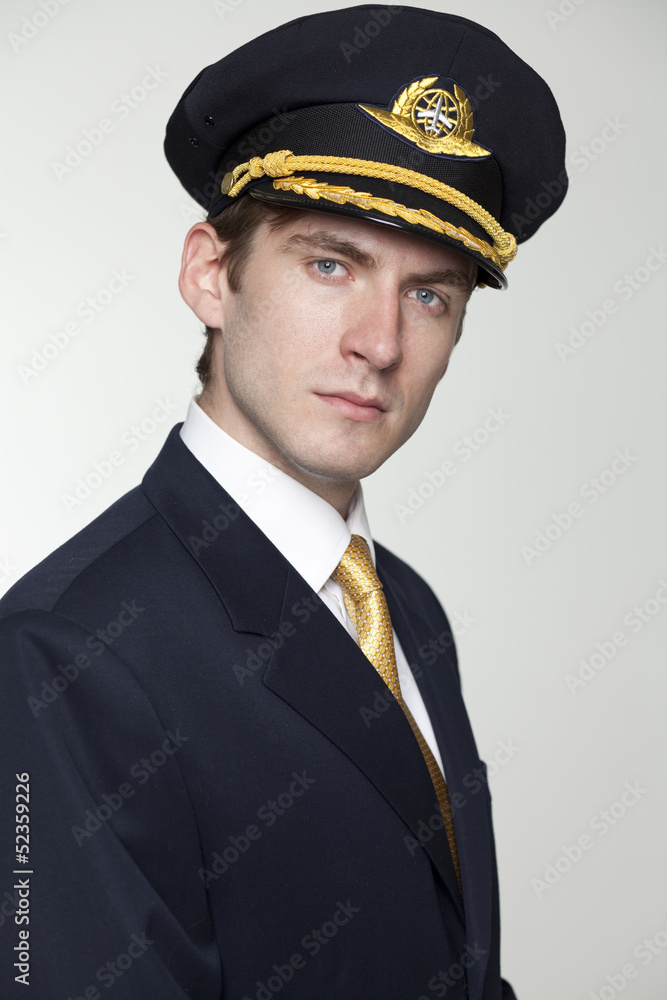 Young man in the form of a passenger plane pilot Young man in the form of a passenger plane pilot