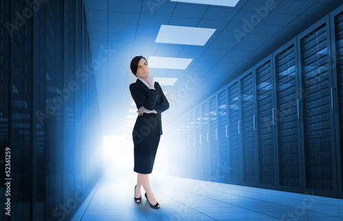 Businesswoman standing in data center © WavebreakmediaMicro