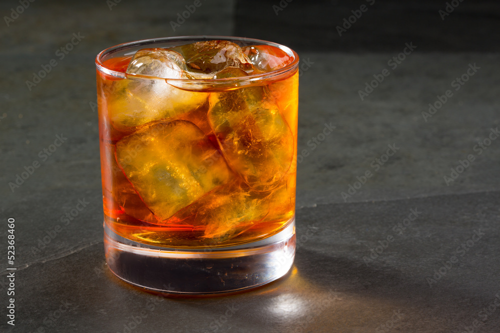 Whiskey whisky on the rocks on glass Whiskey whisky on the rocks on glass